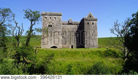 Hermitage Castle Is A Half-ruined Castle On Hermitage Water, Located In The Scottish Borders Area Of