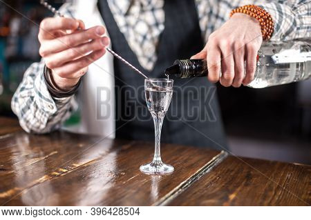 Barman Formulates A Cocktail On The Porterhouse