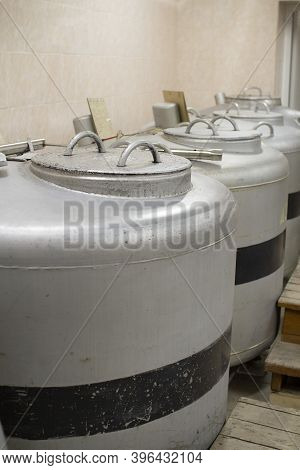 A Can Of Liquid Nitrogen Containing Straws For Fertilizing Cows.