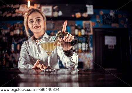 Professional Girl Bartending Demonstrates His Professional Skills While Standing Near The Bar Counte