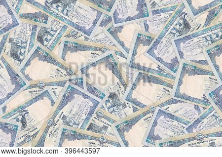 50 Nepalese Rupees Bills Lies In Big Pile. Rich Life Conceptual Background