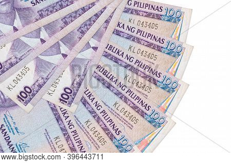 100 Philippine Piso Bills Lies Isolated On White Background With Copy Space Stacked In Fan Shape Clo