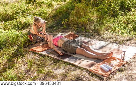 Master Massage Therapist Impliments Her Massage Abilities In Nature.