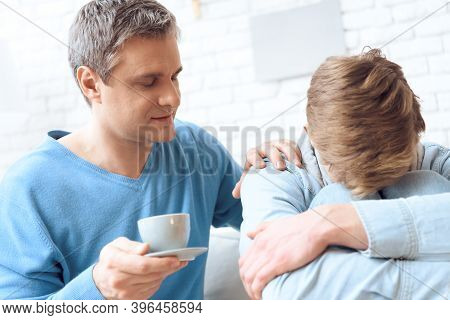 Father Tries To Comfort His Son With Coffee, But Problem Teenager Turning Away.
