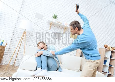 Father Swings His Belt To Hit His Son. Troubled Teenager Isn't Trying To Defend Himself.