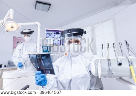 Patient Pov Of Dentist Examining Patient Teeth X-ray During Covid Gloabl Pandemic. Stomatology Speci