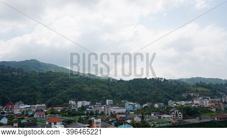 Drone View Of The City Of Patong, Phuket Island. Houses Of Different Heights Stand On The Beach. Gre