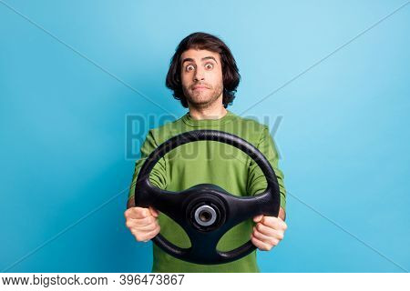 Portrait Of Nervous Car Driver Hold Steer See Danger On Road Wear Pullover Isolated On Blue Color Ba