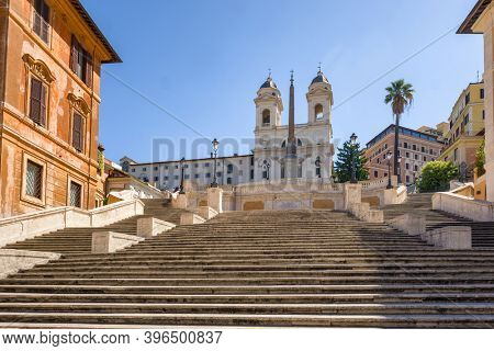 Empty historic spanish stairs and Chiesa della Trinita dei Monti church at Piazza di Spagna in Rome, Italy
