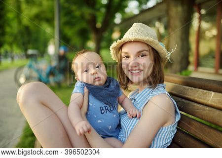 Cute Big Sister Admiring Her Baby Brother. Adorable Teenage Girl Holding Her New Baby Boy Brother. K