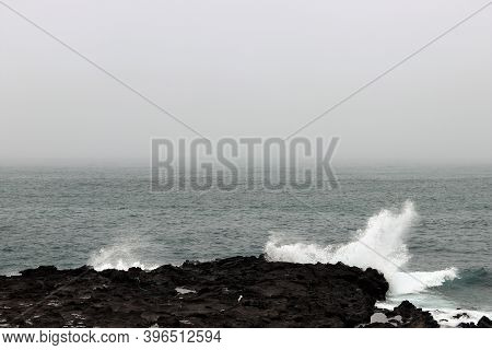 Waves Hitting The Coast Side In Udo Island. Udo Is A Small Island