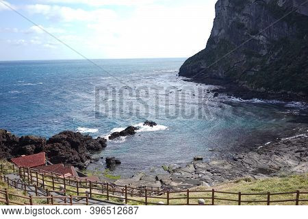 Waves Hitting The Coast Side In Udo Island. Udo Is A Small Island