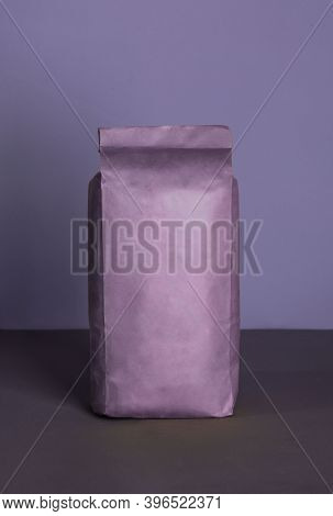 Small Blank Bulky Purple Package With Product On A Purple-lilac Background . Ready For Shipping, Del
