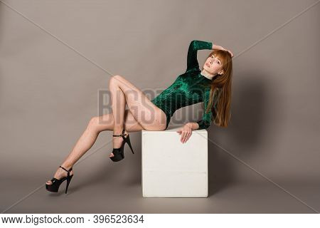 Young Beautiful Dancer Posing In Studio On Grey Background