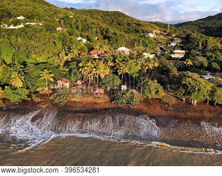 Guadeloupe Beach Drone Sunset View. Plage Caraibe Black Beach Aerial View In Pointe Noire. Backlit O