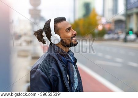 Portrait of a handsome young man on the city street 