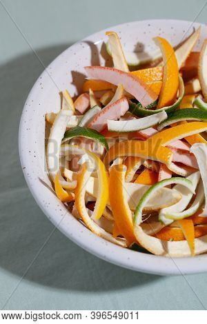 Sliced Citrus Fruit Peel For Cooking Candied On White Plate Close-up. Concept Reducing Food Waste