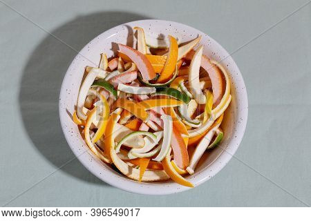 Sliced Citrus Fruit Peel For Cooking Candied On White Plate. Concept Reducing Food Waste