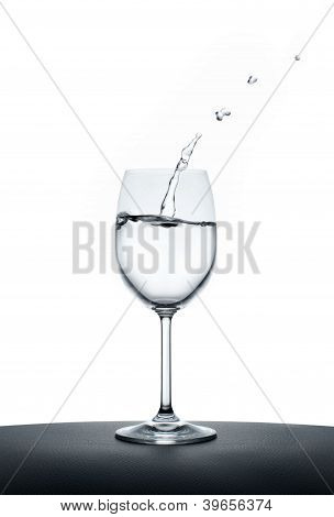 Splashing Water Wave In The Wine Glass