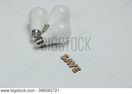 Eco Three Led Light Bulbs On Blue Background. Save Energy Concept. Top View