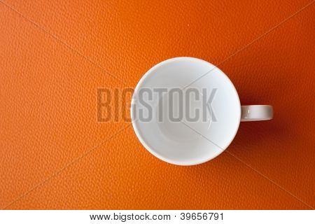 White Cup On Orange Background