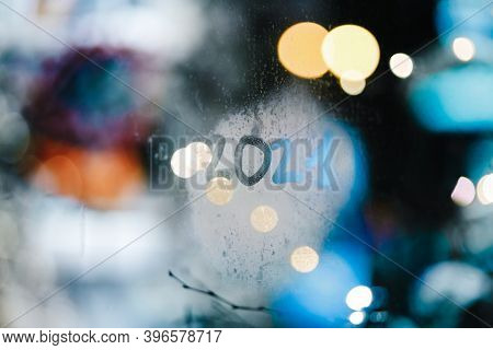 85mm View Of Lettering 2021 Written On Foggy Display Window Of Shopping Mall