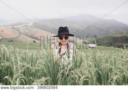 Tourist Asian Women Standing On Green Rice Terraces Field At Baan Pa Bong Piang,chiang Mai,thailand