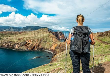 Girl Hiking Rocky Cliffs Clear Near Water Of Atlantic Ocean Bay Ponta De Sao Lourenco, The Island Of