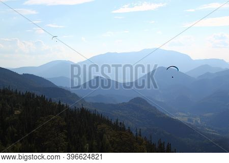 Great Paragliding Moment: Paragliding Concept / Paraglider Flying In Beautiful Natural Mountain Land