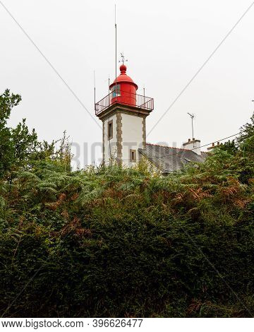 The Lighthouse Of Morgat (brittany, France) On A Cloudy Day In Late Summer
