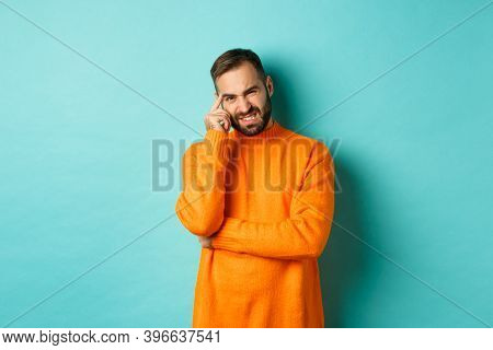 Man With Beard, Grimacing And Cringe From Something Embarrassing, Looking With Awkward Face, Standin