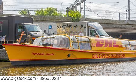 Amsterdam, Netherlands - May 17, 2018: Dhl Express Delivery Boat At Canal In Amsterdam, Holland.