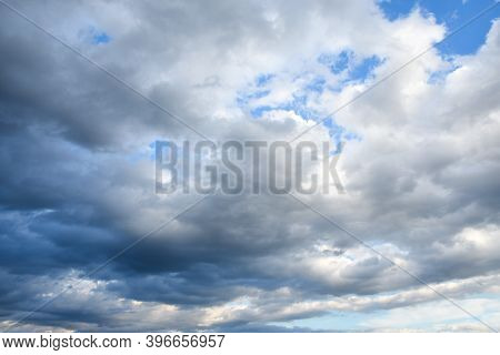 Stormy Sky With Storm Clouns On The Sunset With A Beautiful Sun