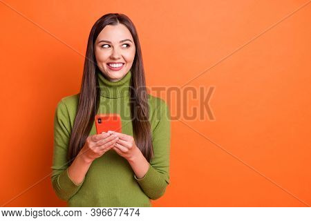 Photo Of Young Beautiful Smiling Cheerful Positive Lovely Girl Look Copyspace Hold Smartphone Isolat