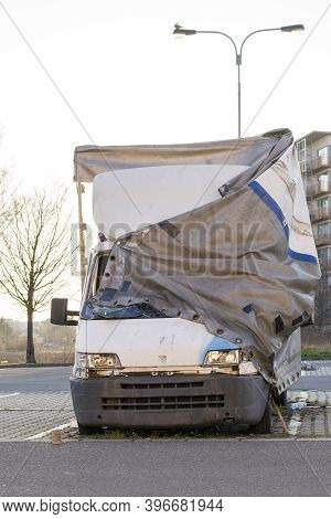 Damaged Van Left Behind By A Driver. Broken Truck Abondoned By A Driver And Damaged By City Teenager