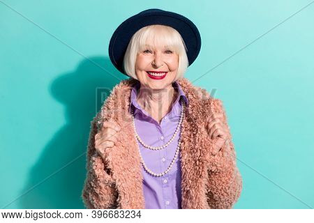Photo Of Charming Sweet Old Woman Dressed Vintage Outerwear Cap Smiling Isolated Turquoise Color Bac
