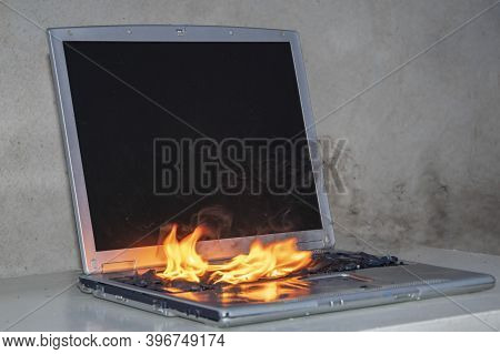 In The Room On The Table The Laptop Caught Fire, The Ignition Of The Battery And Contacts, A Short C