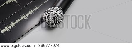 Podcast Record. Microphone And Sound Track At Tablet. Grey Monochrome. Audiobook And Podcasting. Aud