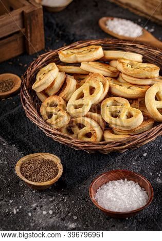 Close Up Of Homemade Pretzels With Cummin Seed And Salt In Little Wicker Basket