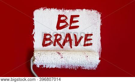 Be Brave. .one Open Can Of Paint With White Brush On Red Background.