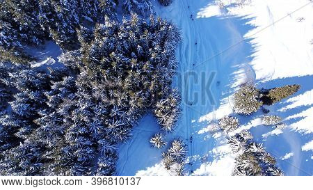 Active Recreation Of People In The Mountains. Top View From The Throne. A Group Of People Walking Al