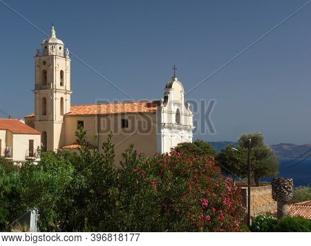The Roman Catholic Church Of The Assumption In Cargese With The Sagone Bay Behind