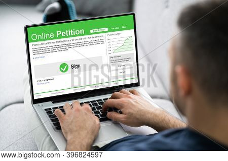 Filling And Signing Online Petition Form On Computer
