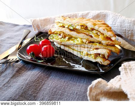 Whole-meal bread sandwich topped with Lyon rosette and butter