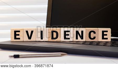 Evidence Word Written On Wood Block. Evidence Text On Table, Concept