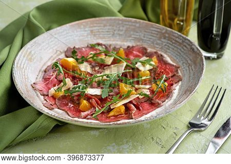 Italian Cuisine: Vitello Tonnato With Capers, Arugula, Tomatoes On A Plate Close-up. Horizontal