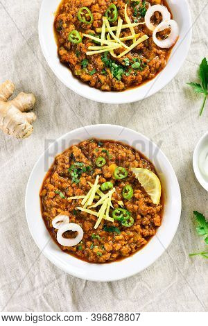 Keema Curry In Bowls Over Light Background. Indian And Pakistani Style Dish. Top View, Flat Lay
