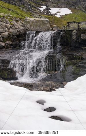 Small Waterfall On The Norwegian Mountain Plateau Roldal Fjellet