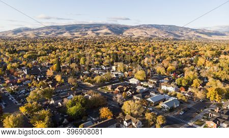 Drone  Photo Of Reno Neighborhoods During The Fall Sesason Looking Towards The Mountains.