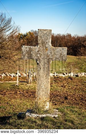 Ancient Stone Christian Cross In A Rural Scene Near The Small Village Of Velo Veronese, Lessinia Pla
